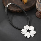 Gold plated statement necklace with large flower pendant