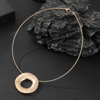 Gold plated statement necklace with large circle pendant