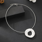 Gold plated statement necklace with large circle pendant