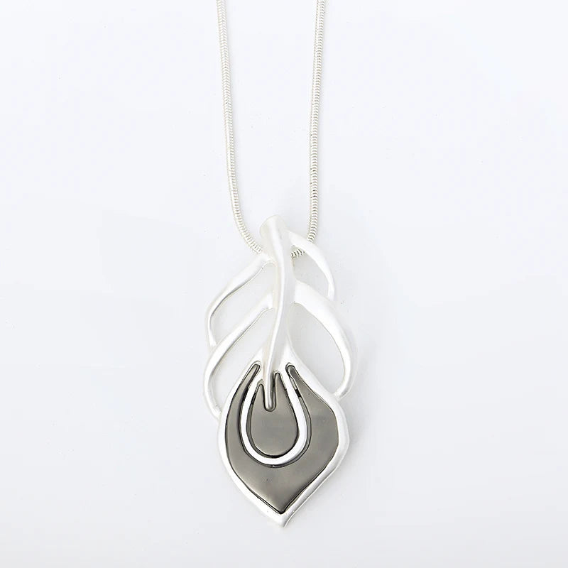 Silver necklace with a unique pendant on a white background