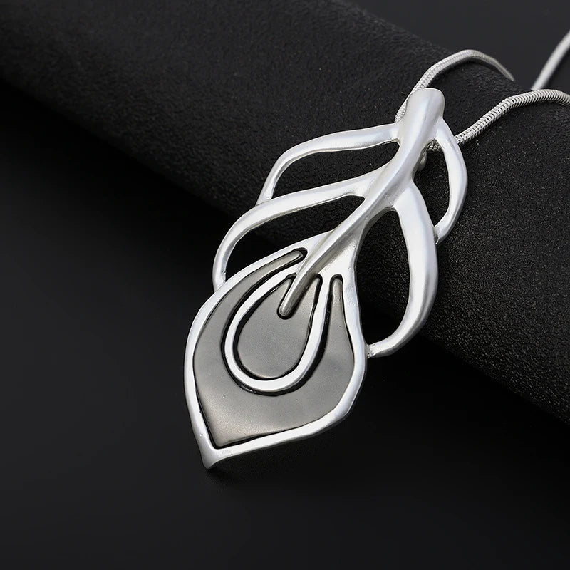 Silver pendant on a black background