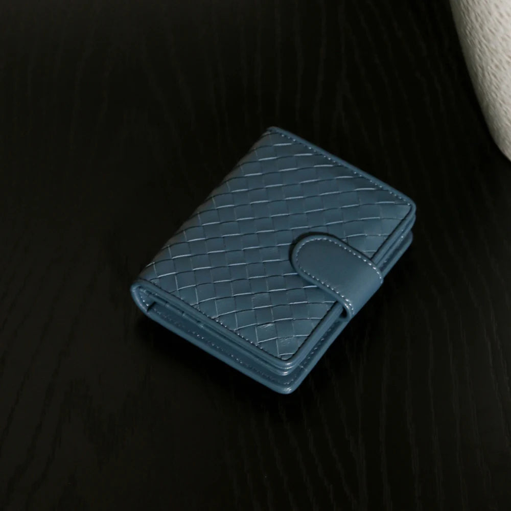 Handcrafted Nappa leather woven wallet in a rich earthy red-brown hue, showing a compact bi-fold design and premium textured