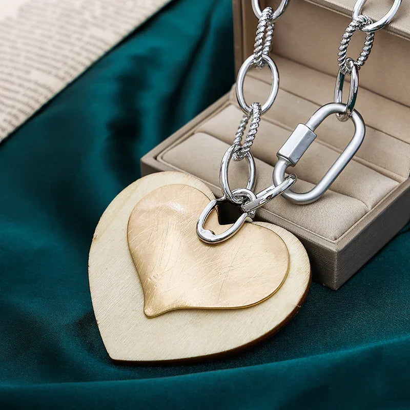 Modern gold and silver dual heart necklace on white background, minimalist fashion jewelry | Civibuy jewelry near New York