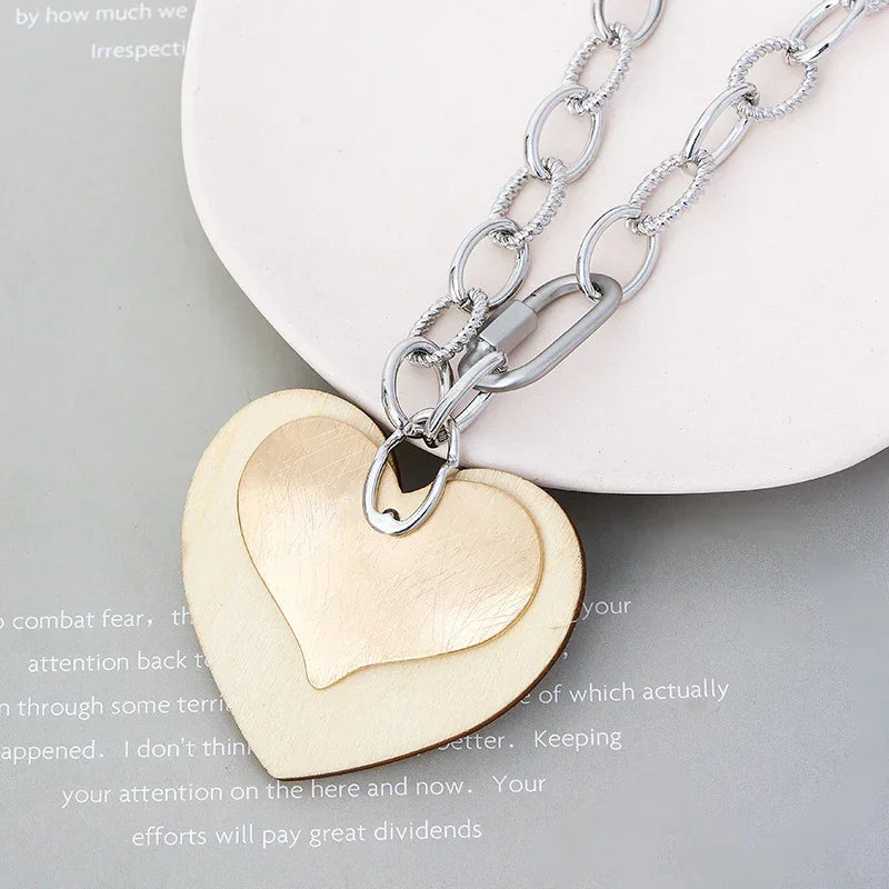Woman wearing dual heart layered pendant necklace, elegant gold and silver chain jewelry, perfect romantic gift | Civibuy wholesale USA