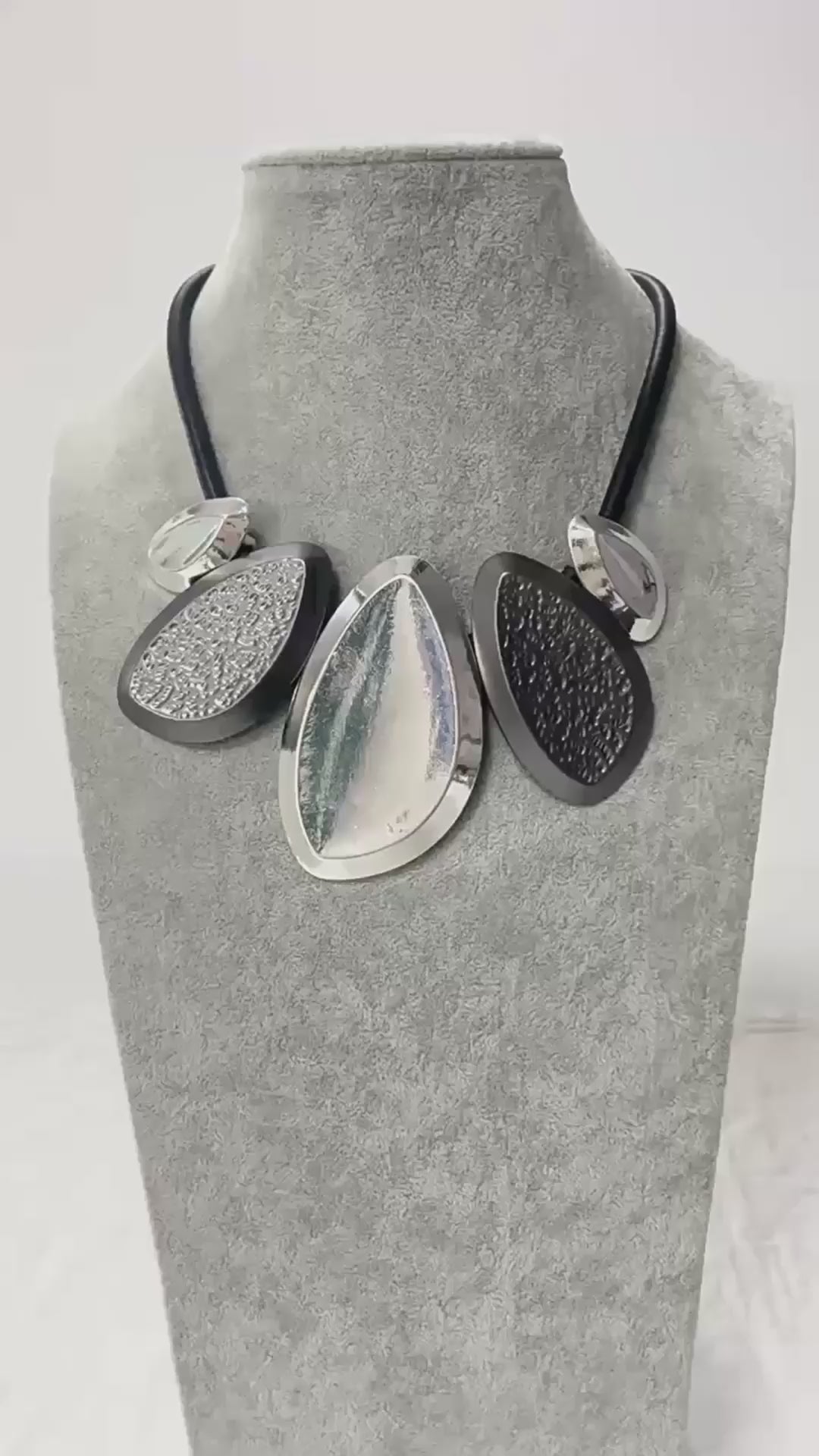 Woman wearing modern geometric silver statement necklace, bold contemporary jewelry | Civibuy wholesale USA
