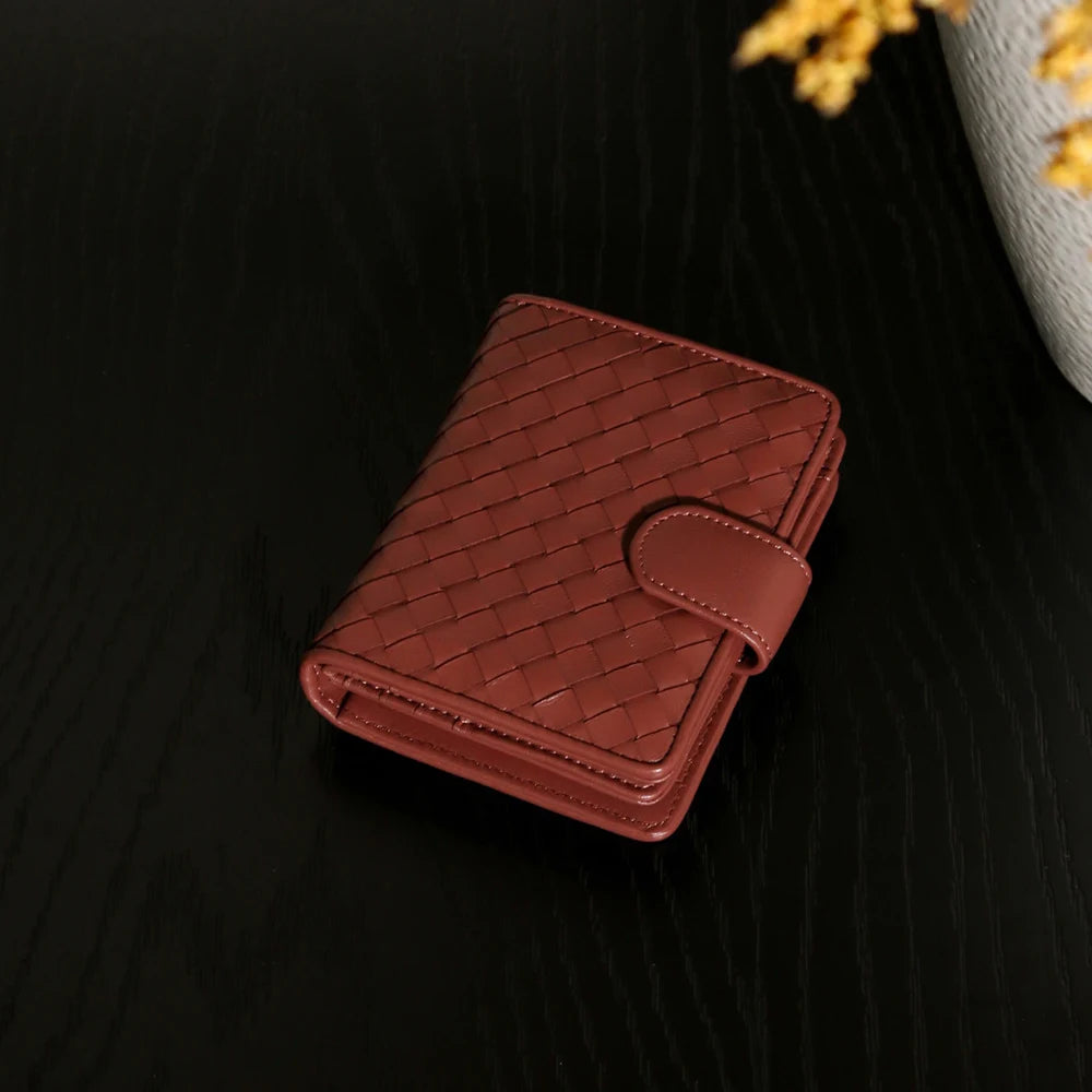 Handcrafted Nappa leather woven wallet in a rich earthy red-brown hue, showing a compact bi-fold design and premium textured
