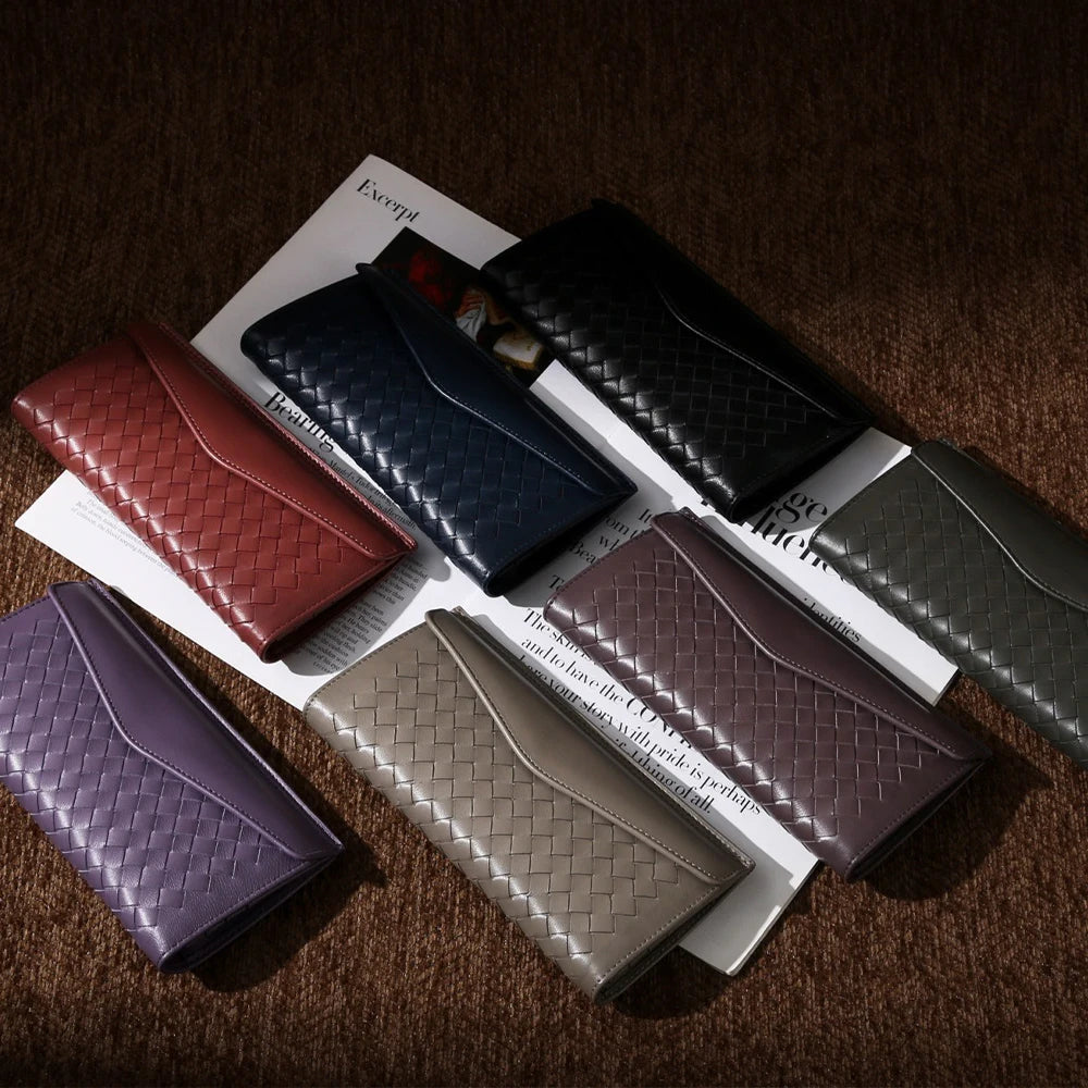 Experience the buttery softness of our Artisanal Sheepskin Woven Wallet. A slim bifold design featuring a secure coin purse and bill storage.