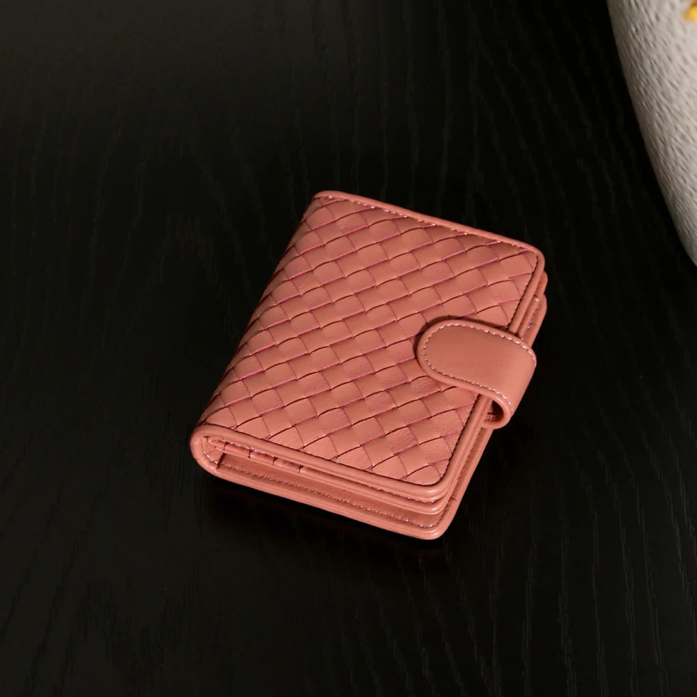 Handcrafted Nappa leather woven wallet in a rich earthy red-brown hue, showing a compact bi-fold design and premium textured