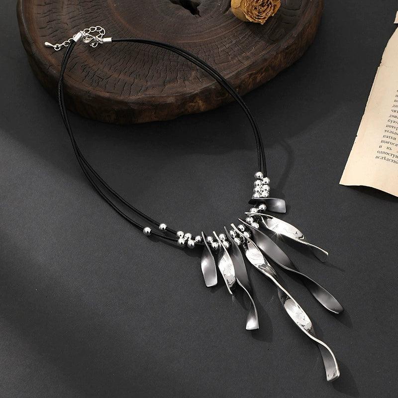 Women’s silver and black statement necklace with leather cord and unique pendant design