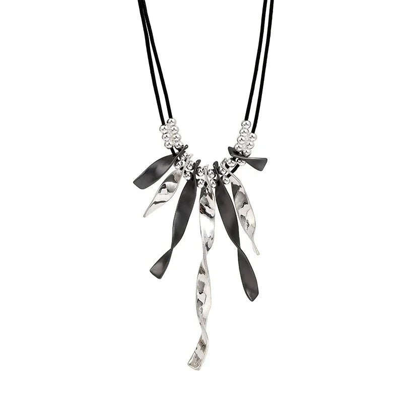 Women’s silver and black statement necklace with leather cord and unique pendant design