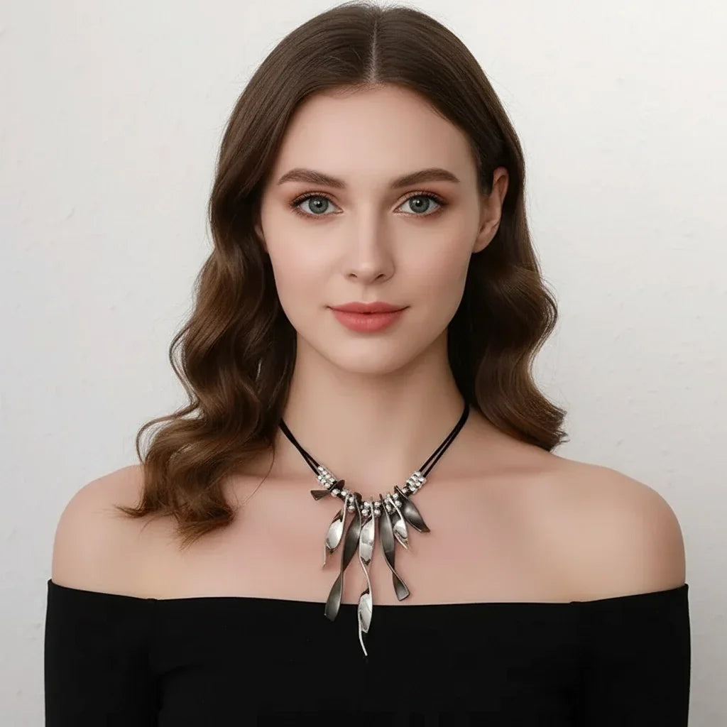 Women’s silver and black statement necklace with leather cord and unique pendant design